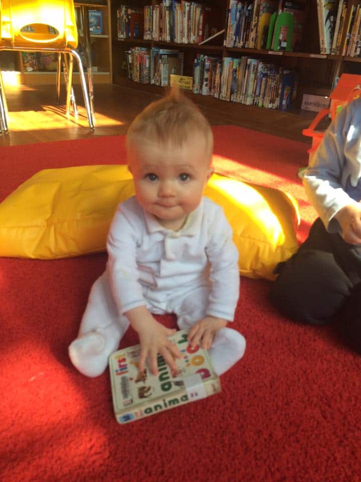 Library baby and book